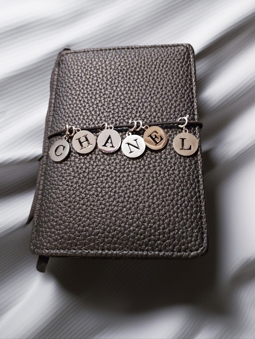CHANEL Black Pebbled Cover Lined Notebook Journal - Silver Charm & Strap Closure